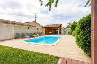 a swimming pool in the backyard of a house at Les gites de Bel-Air en Luberon in Les Taillades