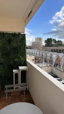 a balcony with a bench on top of a building at Slux Studio 399 in Aix-en-Provence