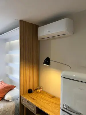 a kitchen with a refrigerator and a lamp in a room at Slux Studio 399 in Aix-en-Provence