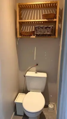 a bathroom with a white toilet in a room at Slux Studio 399 in Aix-en-Provence