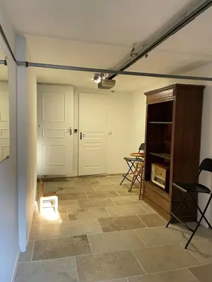 a room with a door and a table and chairs at Apartment in L'Isle-sur-la-Sorgue with parking in LʼIsle-sur-la-Sorgue