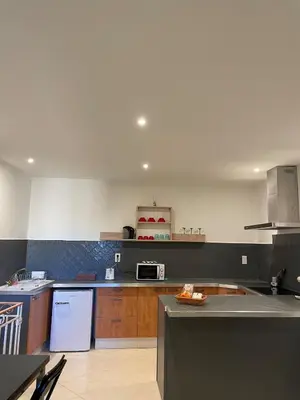 a kitchen with a stove and a counter top at Apartment in L'Isle-sur-la-Sorgue with parking in LʼIsle-sur-la-Sorgue