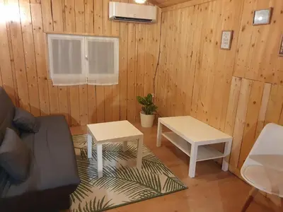 a living room with a couch and a table at Chalet en provence