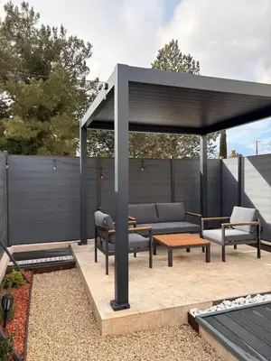 a gazebo with couches and tables on a patio at Esprit Lubéron, La Lavande, logement entier in Le Thor