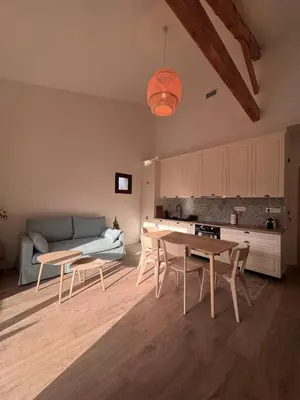 a living room with a couch and a table at Esprit Lubéron, La Lavande, logement entier in Le Thor