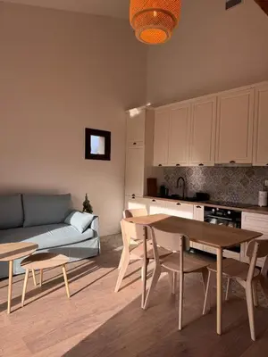 a living room with a couch and a table at Esprit Lubéron, La Lavande, logement entier in Le Thor