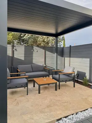 acovered patio with couches and a table and chairs at Esprit Lubéron, La Lavande, logement entier in Le Thor
