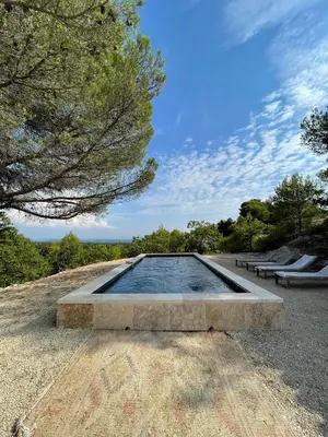 a pool of water sitting on top of a field at Luberon house with view in Cucuron