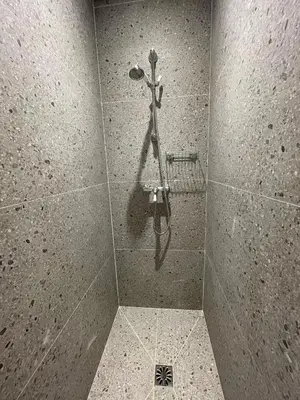 a shower stall with a hose in a bathroom at Luberon house with view in Cucuron