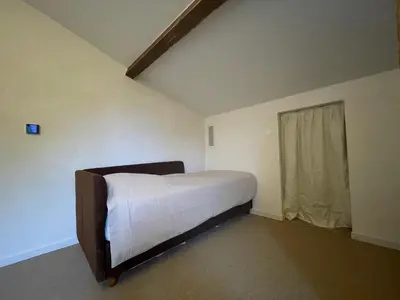 a bedroom with a bed in a room with a window at Luberon house with view in Cucuron