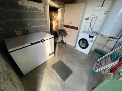 an overhead view of a laundry room with a refrigerator at Le gîte des granges in Bédoin