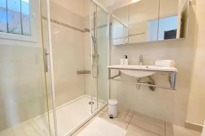 a bathroom with a shower and a sink at Family villa with garden and pool in LʼIsle-sur-la-Sorgue