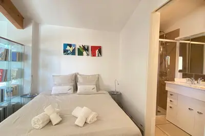 a bedroom with a bed with towels on it at Family villa with garden and pool in LʼIsle-sur-la-Sorgue