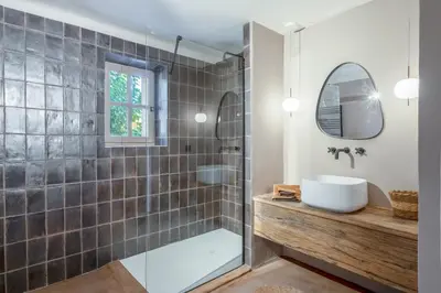 a bathroom with a tub and a sink and a shower at Bastide de Guby in Saint-Saturnin-les-Apt