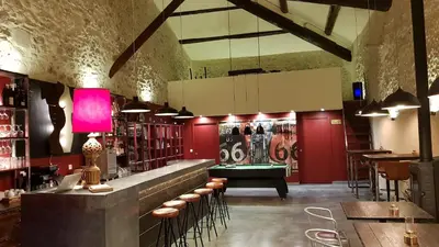 a bar with a pool table in a room at Domaine De Pradaous in Reillanne