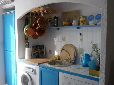 a kitchen with a sink and a washing machine at Holiday Home by Interhome in Pierrevert