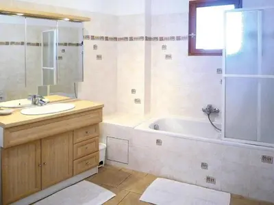 a bathroom with a sink and a tub and a shower at Apartment Morard - Bonnieux Appt Les Ocres by Interhome in Bonnieux