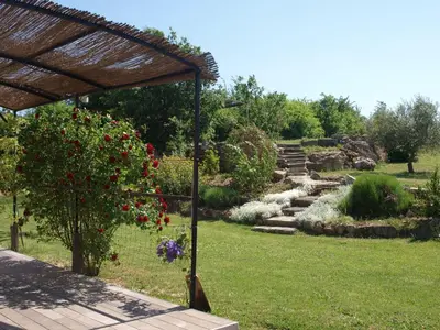 a garden with flowers and stairs in the background at Holiday Home Provenzalisches Ferienhaus mit Charme auf dem Land mit Pool by Interhome in Villars