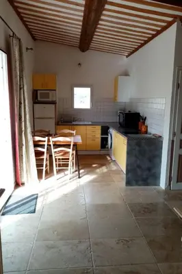 a kitchen with a table and chairs in a room at Holiday Home Provenzalisches Ferienhaus mit Charme auf dem Land mit Pool by Interhome in Villars