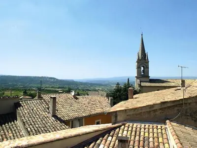 a view of a church with a clock tower at Apartment Morard - Bonnieux Appt 2- Etage by Interhome in Bonnieux