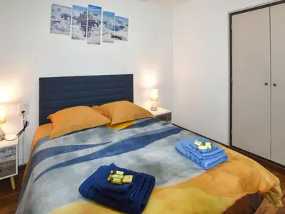 a bedroom with a large bed with blue towels on it at Holiday Home Villa Roche en Provence Süd Luberon by Interhome in Ansouis