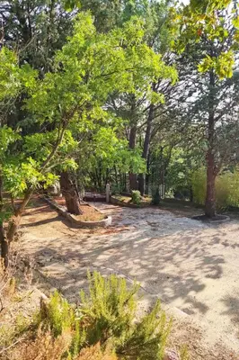 a park with a lot of trees and sand at Holiday Home Villa Roche en Provence Süd Luberon by Interhome in Ansouis