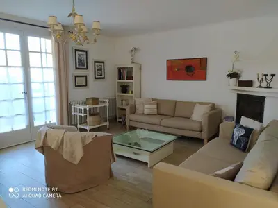 a living room with a couch and a table at Holiday Home Schöne provenzalische Villa Les Carlets mit Pool by Interhome in Saignon
