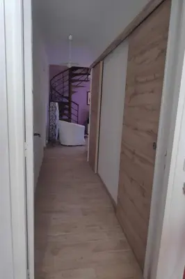 a hallway with a wooden door in a room at Holiday Home Schöne provenzalische Villa Les Carlets mit Pool by Interhome in Saignon