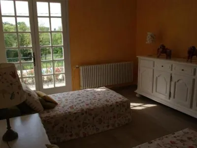 a bedroom with a bed and a large window at Holiday Home Schöne provenzalische Villa Les Carlets mit Pool by Interhome in Saignon