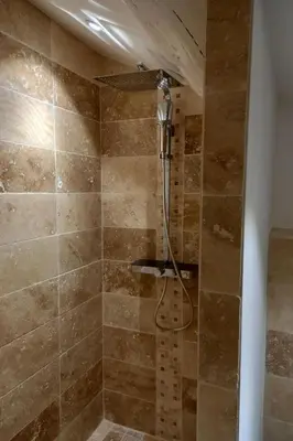 a shower with a shower head in a bathroom at Apartment Valentins Gîte Moulin de Tartay in Avignon by Interhome in Avignon