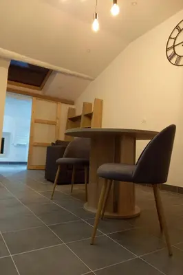 a table and two chairs in a room at Apartment Valentins Gîte Moulin de Tartay in Avignon by Interhome in Avignon