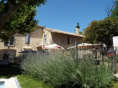 a house with a fence in front of it at Holiday Home Moulin de Tartay in Avignon by Interhome in Avignon