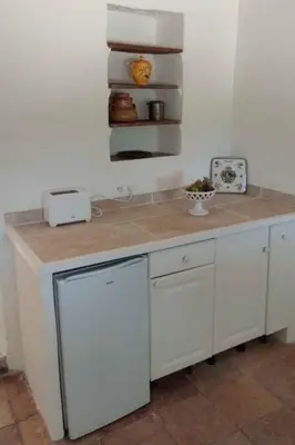 a counter in a kitchen with a counter top at Holiday Home Domaine Santonne by Interhome in Apt