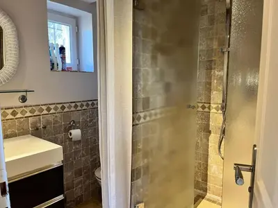 a bathroom with a shower and a sink at Holiday Home Das Atelier im Mas Naste by Interhome in Eygalières