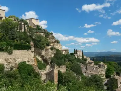 a mountain with houses on top of it at Apartment Morard - Bonnieux Appt Bleu Provence by Interhome in Bonnieux