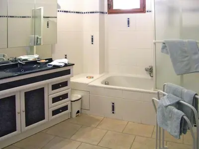 a bathroom with a sink and a bath tub at Apartment Morard - Bonnieux Appt Bleu Provence by Interhome in Bonnieux