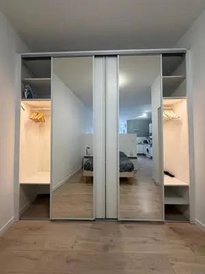 a room with sliding glass doors and a bedroom at La Casa Grans - Charme et calme en Provence in Grans