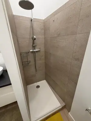 a shower in a bathroom with a glass door at La Casa Grans - Charme et calme en Provence in Grans