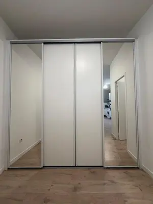 a sliding glass door with a mirror in a room at La Casa Grans - Charme et calme en Provence in Grans