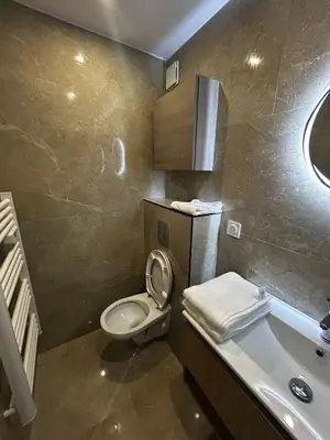 a bathroom with a toilet and a sink and a tub at Studio 2 personnes maximum in Saint-Andiol