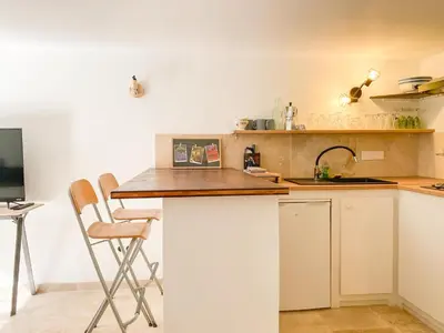 a kitchen with a counter and a sink at LAVANDE in Apt