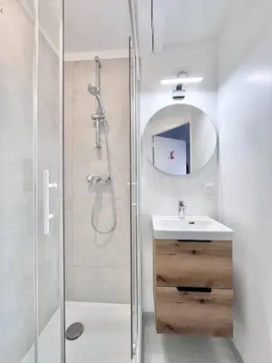 a bathroom with a shower and a sink and a mirror at Aix-en-Provence, Studio rénové au coeur de ville Calme absolu in Aix-en-Provence