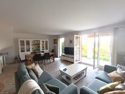 a living room with a blue couch and a table at Maison climatisée 6 pers. avec piscines au Domaine Pont Royal - FR-1-658-38 in Mallemort