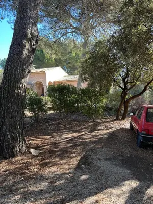 a red car parked in front of a house at T2 avec Terrasse à Ventabren proche Aix in Ventabren