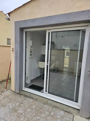 a sliding glass door of a house at Le cocon de mag in Miramas