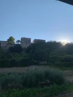 a view of a field with a building in the background at Cocon en Provence à Ménerbes in Ménerbes