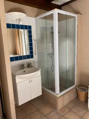 a bathroom with a bath tub and a sink at Karen house with courtyard at the foot of the Luberon in Maubec