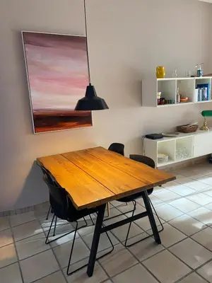 a living room with a couch and a table at Karen house with courtyard at the foot of the Luberon in Maubec