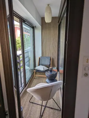 a room with a chair and a bowl on a table at Downtown suite, parking, loggia, elevator, quiet in Aix-en-Provence
