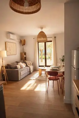 a living room with a couch and a table at Appartement 4 personnes 5 minutes a pieds du centre ville parking gratuit jardin 85m2 in LʼIsle-sur-la-Sorgue